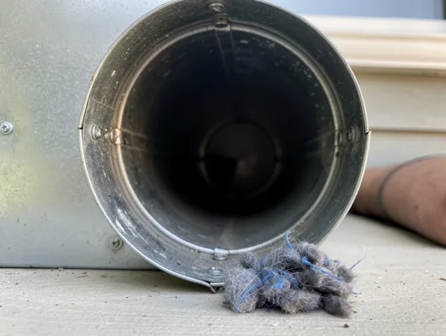 Westerly Dryer Vent Cleaning technician using specialized equipment to clear severe dryer vent blockage in Westerly